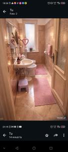 a bathroom with a sink and a toilet and a shower at B&B Amarantha Gothica Genoa in Genoa