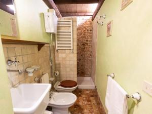 a bathroom with a toilet and a sink at Agriturismo Case Mori in Rimini +44 photos