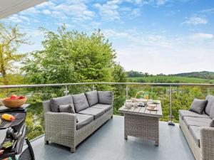 a patio with two couches and a table at 2 Bed in Barnstaple oc-94038 in Bishops Tawton