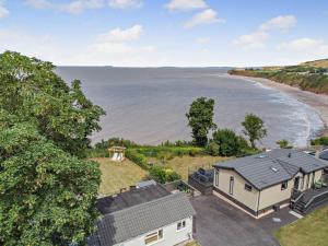 an aerial view of a house and the ocean at 2 Bed in Taunton oc-96234 in West Quantoxhead
