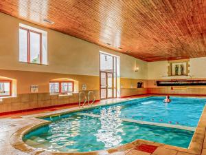 a swimming pool with a person in the water at 2 Bed in Taunton oc-96234 in West Quantoxhead