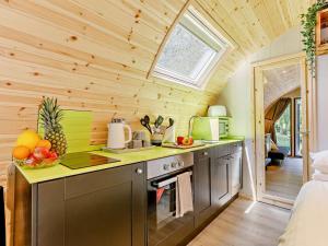 a kitchen in a tiny house with a window at 2 Bed in Okehampton oc-92385 in Okehampton +15 photos