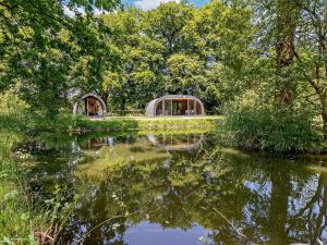 a view of a lake with trees and a house at 2 Bed in Okehampton oc-92385 in Okehampton