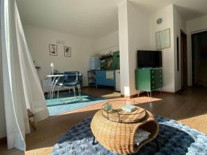a living room with a table in the middle of a room at Seeblick VILLA LAGUNA BLUE - Private Spa - Whirlpool & Sauna in Gardone Riviera