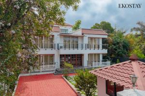 an exterior view of a house at EKOSTAY Gold - Amara Villa in Alibaug