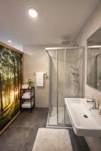 a bathroom with a shower and a sink at Bio Hof Bichler in Mariazell