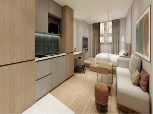 a hotel room with a kitchen and a bedroom at Charis Hotel in Incheon