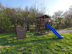 a playground with a slide and a slideintend at Somló Home in Somlószőlős