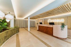 a lobby of an office building with a reception desk at FERGUS Style Palma Beach - Adults Only in Can Pastilla +73 photos