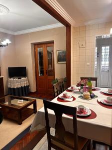 a living room with a table with food on it at Azor International House in Ponta Delgada