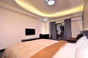 Μια τηλεόραση ή/και κέντρο ψυχαγωγίας στο Yundu Business Hotel
