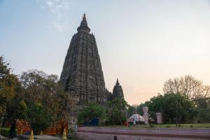 a tall building with a tower in the background at Subhash Guest House in Gaya