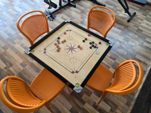 an overhead view of a table with a game at Om Sai Ram Coliving in Bangalore