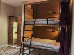 a bunk bed room with two bunk beds in it at TWENTY Hostel in Samarkand