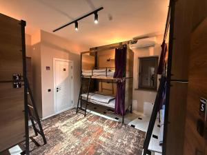 a room with some bunk beds in it at TWENTY Hostel in Samarkand