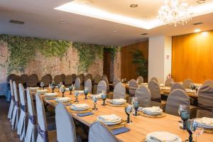 a conference room with a long table and chairs at Alda Carballo in Carballo