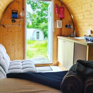 a room with a large window in a tiny house at West Point Woods in Barrow in Furness