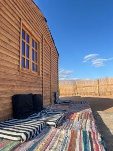 a building with a large rug on the side of it at Anne in Nuweiba