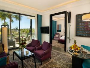 a living room with purple furniture and a balcony at STORY Rabat in Rabat