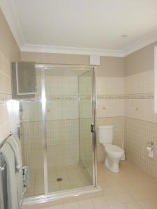 a bathroom with a shower and a toilet at The Honeypot in Balmoral +27 photos