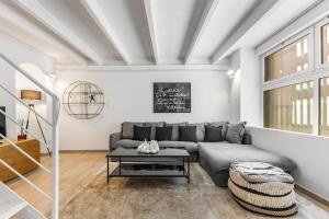 a living room with a couch and a table at Elisabeth s Loft in Milan