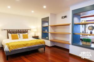 a bedroom with a bed and some shelves at Angra Soul 1 - By PontaNegraAzores in Angra do Heroísmo