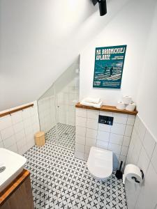a bathroom with a toilet and a sink at Smugi Dom Gościnny in Lipowiec +40 photos