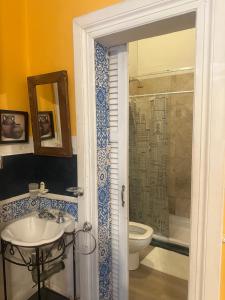 a bathroom with a sink and a toilet at Hotel Posada de 1860 in Tigre