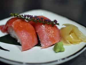 a white plate with two pieces of food on it at 別邸 六花 in Hino