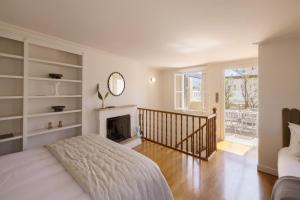 a bedroom with a bed and a fireplace at Once&Forever Estate in Athens