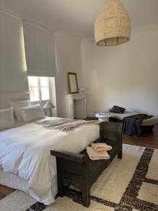a bedroom with a large bed and a pendant light at A Casa Di Rose in Ajaccio