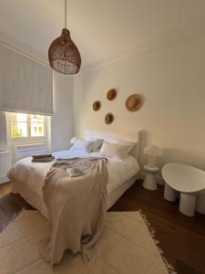 a bedroom with a large bed and a table at A Casa Di Rose in Ajaccio