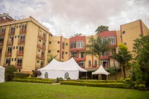 a marquee in front of a building at Grand Global Hotel in Kampala