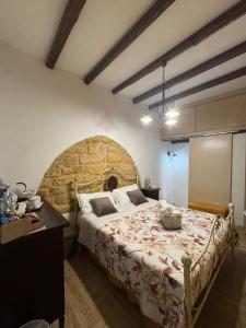 a bedroom with a large bed in a room at b&b centro città in Agrigento
