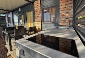 a kitchen with a sink and a counter top at Hipo camp - Mobil home Sestrica in Pakoštane