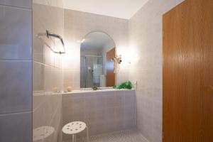 a bathroom with a shower with a sink and a mirror at Hotel Baeren in Leimen +31 photos