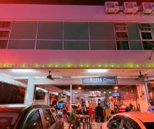a restaurant with people sitting outside of a building at New century inn in Bintulu