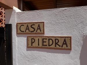 a sign on a wall that reads casa piedra at Casa Piedra, Luxury Family Front Line Golf, Hot Tub,Pool Table, 8 pers, Caleta de Fuste in Caleta De Fuste +40 photos