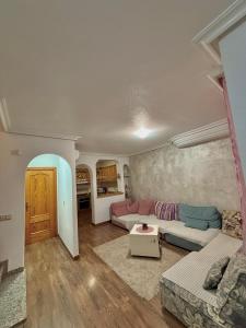 a living room with a couch and a table at Mar y Golf in Orihuela Costa +20 photos