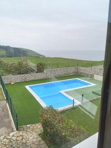 an image of a swimming pool in a yard at CASA FREDO in Cóbreces