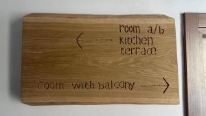 a wooden sign on a wall that reads room with bathroom at Grazia Vecchia 38 in Marsala