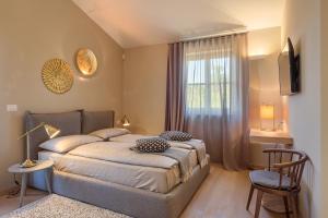 a bedroom with a large bed and a window at Villa Natalie in Vabriga +26 photos