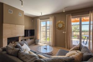 a living room with a couch and a table at Villa Natalie in Vabriga