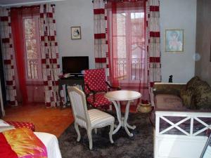 a living room with a couch and a table at Bed & Breakfast Demeure du Pareur in Villeneuve-Minervois +13 photos