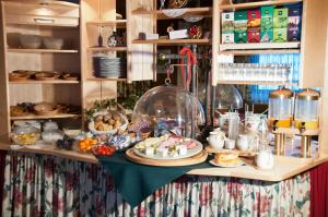 a table with food and other items on it at Pension Gertraud in Bad Kleinkirchheim