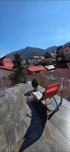 a red chair sitting on top of a patio at Roca Room in Atias