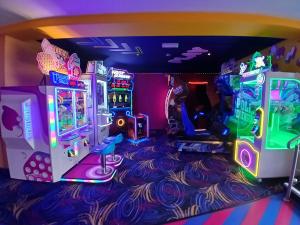 a room with two arcade games on the floor at Steeple Bay F79 in Steeple