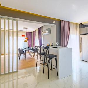 a kitchen and dining room with a table and chairs at canyon villa in Kemer