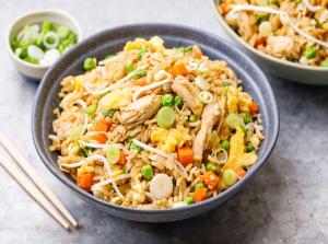 a bowl of food with chicken and vegetables in it at Hotel Olive Aero Suites Near Delhi IGI Airport in New Delhi
