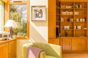 a living room with a chair and a window at Gîte G175 in Grosville